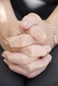 clasped clenched hands